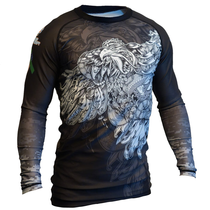 Retro Grapplers Protect our Heroes - veteran mental health rash guard is a black long-sleeve rash guard with a white phoenix on the chest and digital camo sleeves, designed to honor veterans and support TBI awareness.