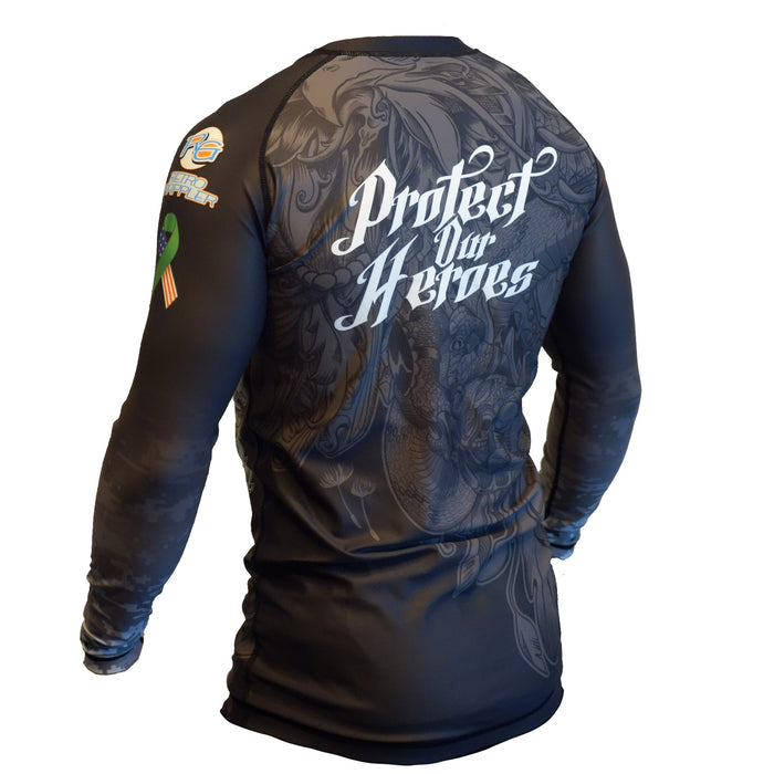 A person wears the Retro Grappler Protect our Heroes - Veteran Mental Health Awareness black rash guard, featuring bold white lettering on the back, colored shoulder patches, and a subtle pattern—honoring veterans.