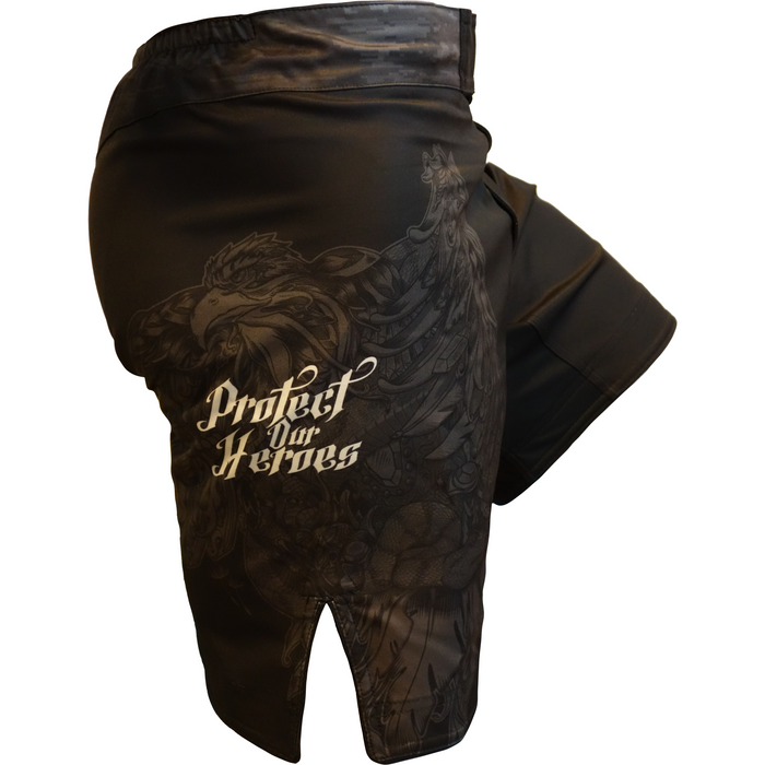 The Retro Grappler Protect Our Heroes Fight Short features a detailed eagle and Protect Our Heroes text, supporting veteran mental health awareness and traumatic brain injury causes. Displayed on a white background.