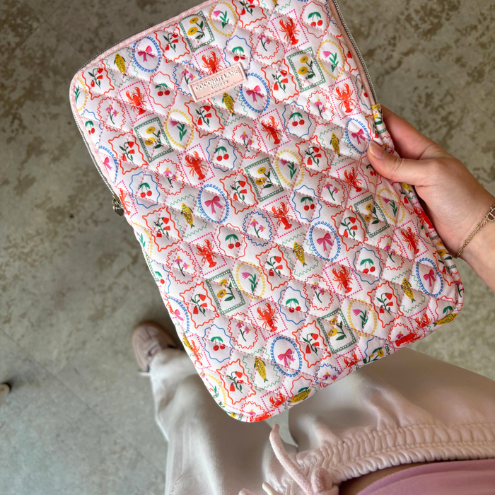 Quilted Dolce Vita iPad sleeve with a colorful, playful print and soft padding by Coconut Lane.