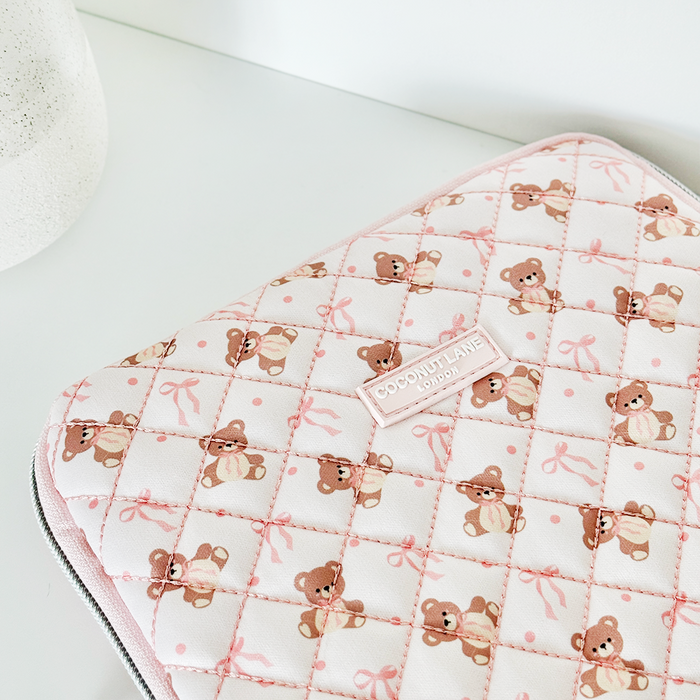 Pink quilted iPad sleeve with white teddy bear and bow pattern by Coconut Lane.