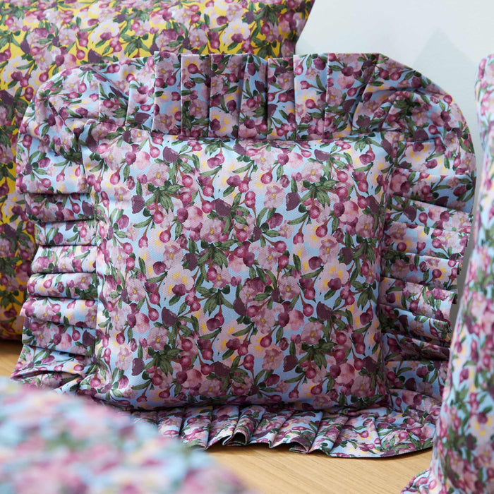 Close-up of the Romance Is Dead Organic Cotton Ruffled Pillow Cover in Blue print