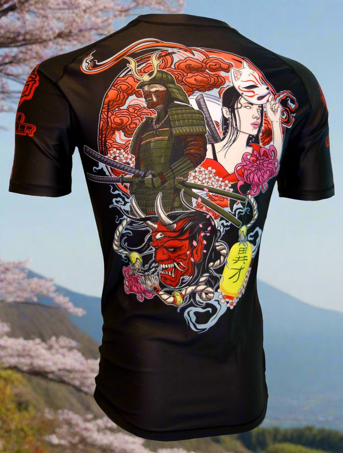 The Retro Grappler Samurai Prodigy: Japanese Jiu Jitsu Rash Guard features Japanese tattoo-inspired art with a samurai, kitsune mask woman, Oni designs, red clouds, pink flowers, and Japanese characters on a cherry blossom landscape.