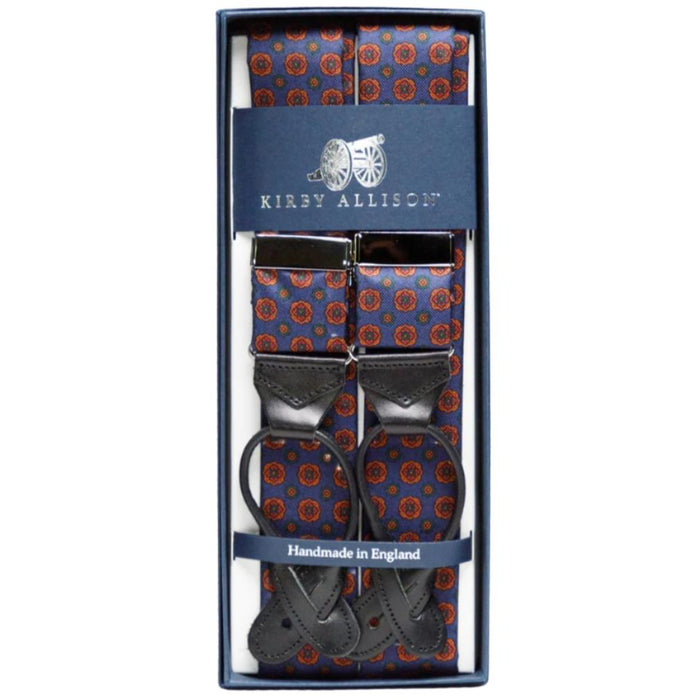 A pair of adjustable blue and orange KirbyAllison.com Sovereign Grade Dark Navy Geometric Floral Ancient Madder Braces suspenders in a box.