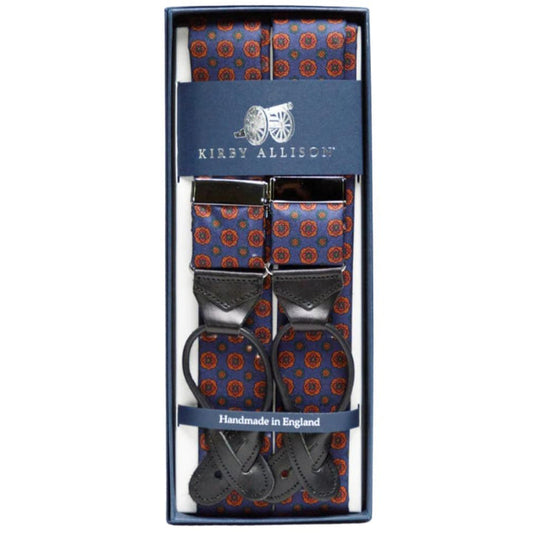 A pair of adjustable blue and orange KirbyAllison.com Sovereign Grade Dark Navy Geometric Floral Ancient Madder Braces suspenders in a box.