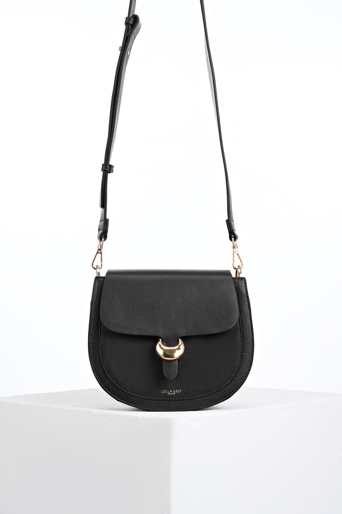 Venetia Black Faux leather Saddle Crossbody with gold Cannon Street Clasp Closure detail on the front flap