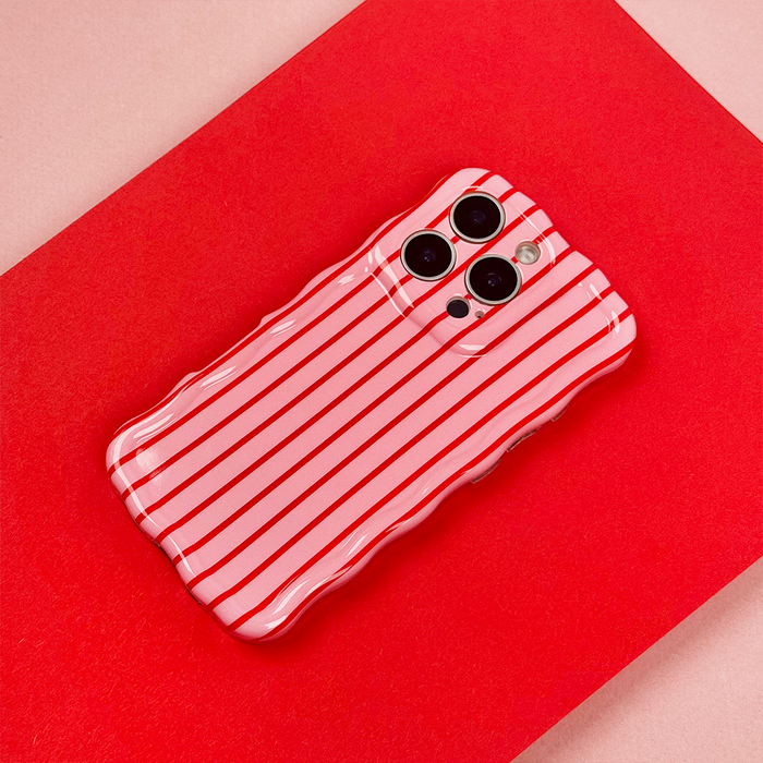Cherry Stripes wavy phone case by Coconut Lane on a red and pink background with a smartphone.