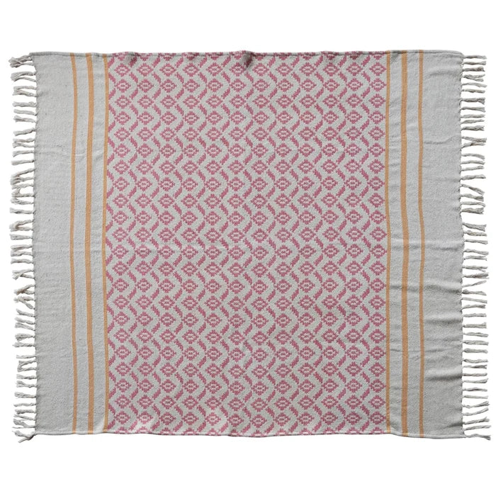 Patterned towel with pink and beige design on a white background