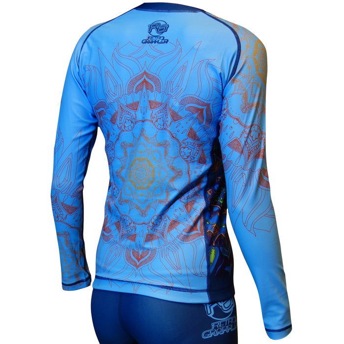 A person wearing the Retro Grappler Zen Line: Mandala Rash Guard—a fitted, long-sleeve light blue athletic shirt with intricate mandala designs—and matching blue shorts for a sleek look from behind.